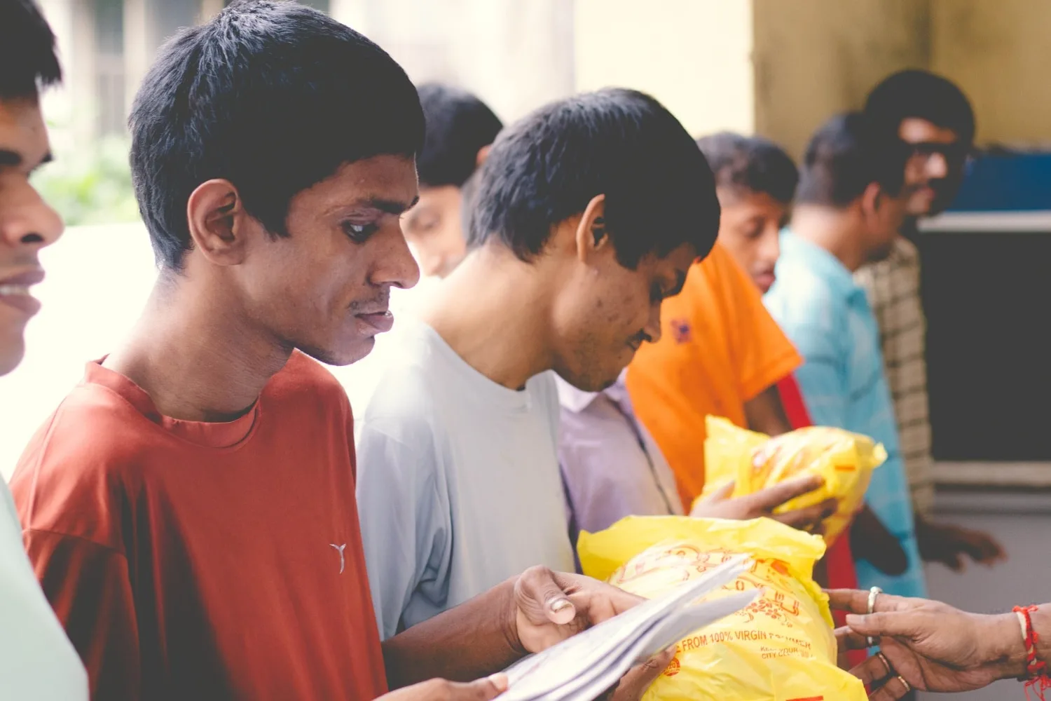 Distributing garments to children